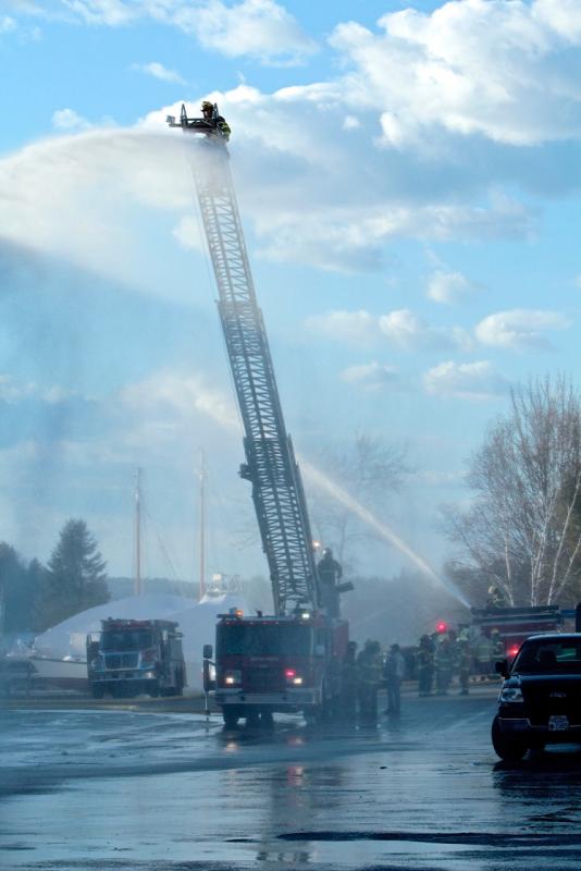 A firefighter tests his skills on a ladder truck during the drill on Southport Island April 19. Courtesy of Robert Mitchell