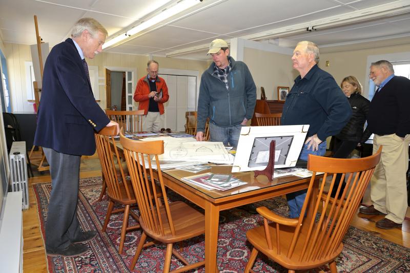 Senator Angus King listens as Boothbay Harbor Shipyard manager Eric Graves (wearing cap) explains a drawing during King’s tour of the shipyard April 15. Standing next to Graves is shipyard owner Terry McClinch. Courtesy of Robert Mitchell