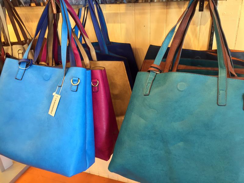 Slick’s is carrying a colorful new line of reversible leather bags.