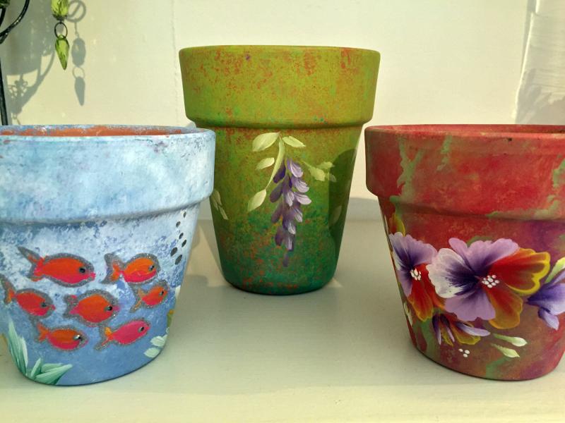 Hand-painted plant pots are available in the new flower shop in Wiscasset, Water Lily Flowers and Gifts. SUZI THAYER/Boothbay Register