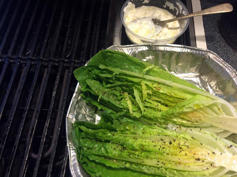 Romaine lettuce has been brushed with olive oil and sprinkled with salt, and is ready to be grilled. SUZI THAYER/Boothbay Register