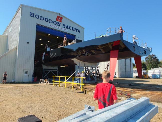Comanche, a 100-foot monohull designed to be fastest of its kind in the world, makes its way out of the Hodgdon Yachts facility to be lowered into Boothbay waters in September 2014. The boat is one of roughly 400 built by the East Boothbay shipyard in its 200 years of existence. CASEY HOUSER/Boothbay Register
