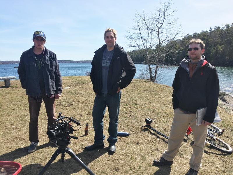 Cody Mitchell, left, Ryan Leighton and Brian Papineau, the production team behind the Boothbay-based online television series Era Man, prepare to shoot a scene on a recent afternoon at Barrett’s Park in Boothbay Harbor. The trio has recently completed the third episode of the coming of age show and plan to film six in total. SUZI THAYER/Boothbay Register