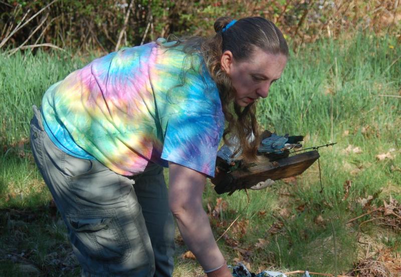Volunteer Deb Lomas picks up construction debris. ART MAYERS/Boothbay Register