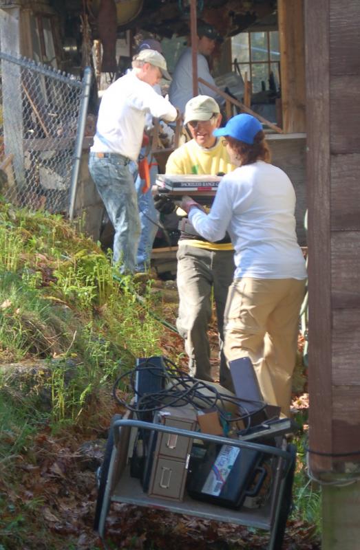 A work crew cleans out a shed that was to be demolished. ART Mayers/Boothbay Register