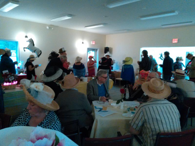 A crowd of more than 100 guests enjoys the community center Kentucky Derby fundraiser at the Rotary clubhouse. JANE CARPENTER/ Boothbay Register