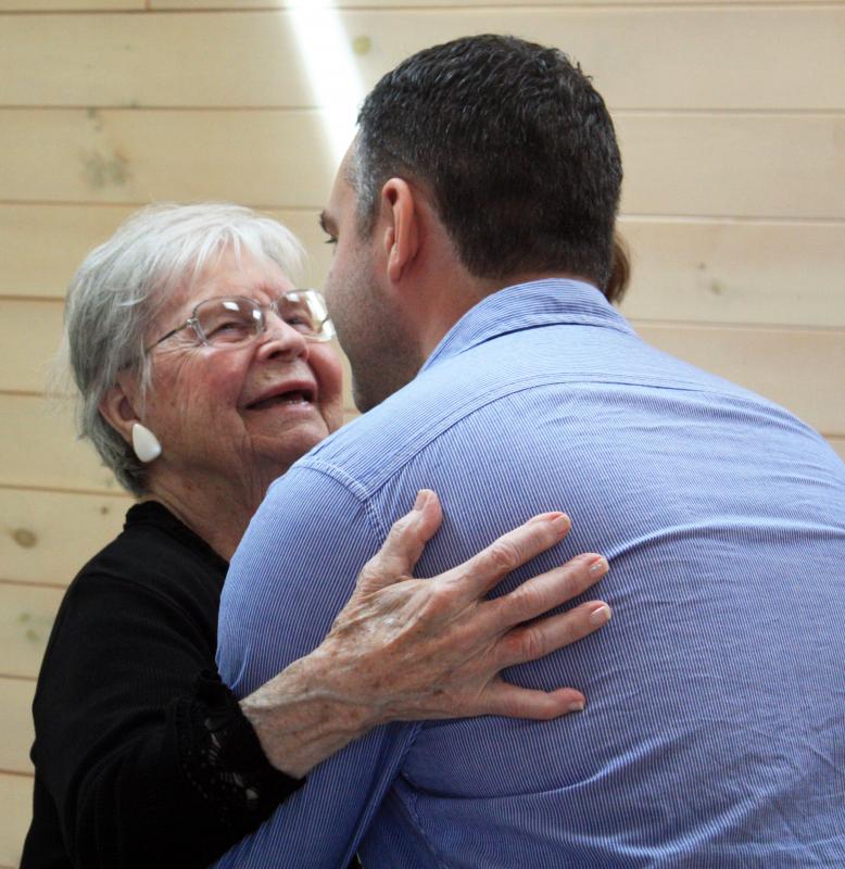 Valerie Smith gets a hug from her grandson. Courtesy of Shri N. A. Verrill