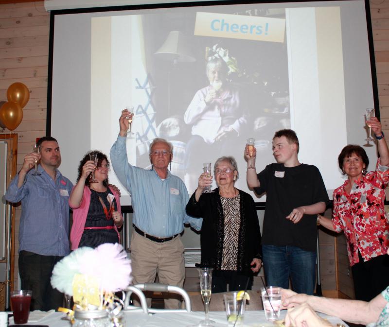 Glasses of champagne were raised at the close of the ceremony in tribute to Valerie Smith’s 100th birthday. Courtesy of Shri N. A. Verrill