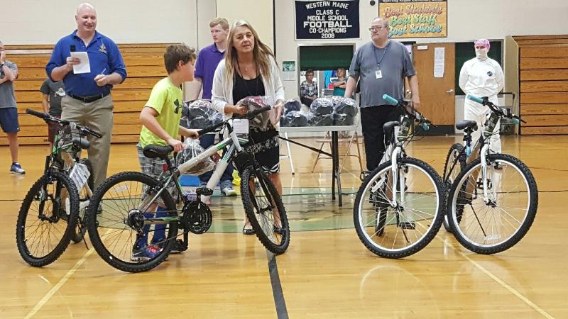 Duncan Hardwick receives a free bicycle at Books for Bikes as he read the most pages in the school with over 4,000 pages read. STEVE EDWARDS/Boothbay Register