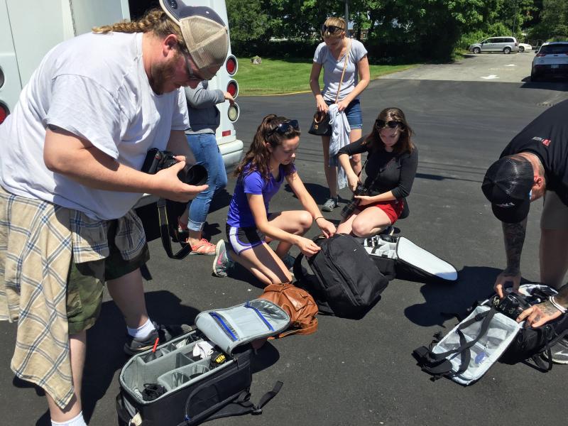 Students from a photography class from Battle Creek, Michigan pack up their equipment before heading out on a whale watch with Capt. Fish in Boothbay Harbor. SUZI THAYER/Boothbay Register