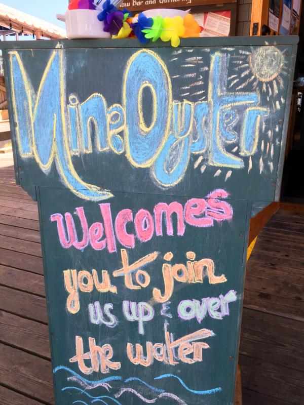 A friendly chalkboard outside the door at The World is Mine Oyster, in Boothbay Harbor. SUZI THAYER/Boothbay Register