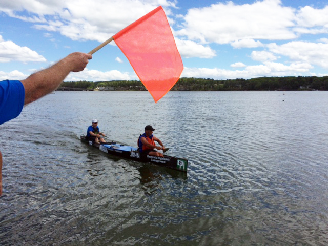 Two canoeists were the second boat to cross the finish line in Wiscasset Harbor. Courtesy of Lucia Droby