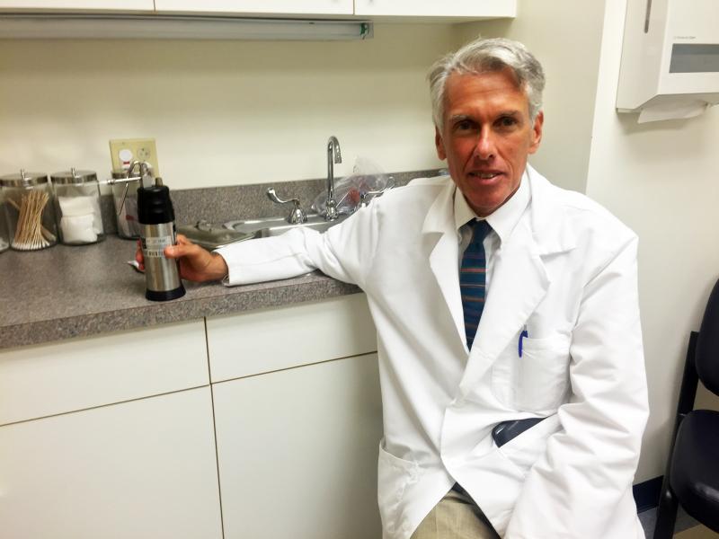 Dr. Ronald Rovner holding one of the tools of his day trade. SUZI THAYER/Boothbay Register