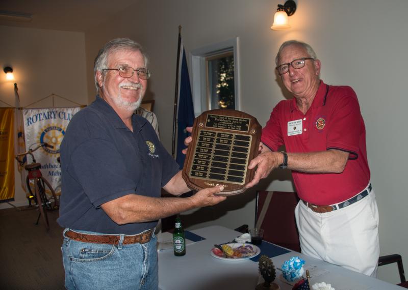 Mike Thompson, left, receives the President’s Award from outgoing club president Ham Meserve. Courtesy photo