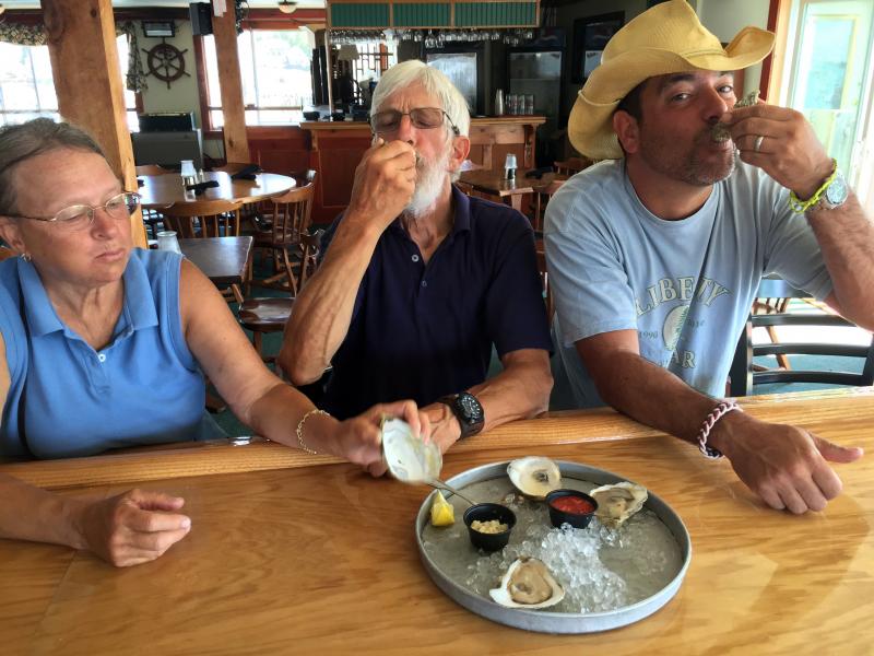 Three oyster lovers at the upstairs bar of The World is Mine Oyster. SUZI THAYER/Boothbay Register
