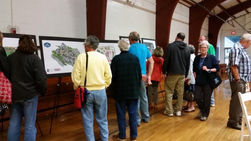 Meeting attendees examine the drawings by Knickerbocker Group showing a completed Route 27 Traffic Improvement Plan. KATRINA RICKERMANN/Boothbay Register