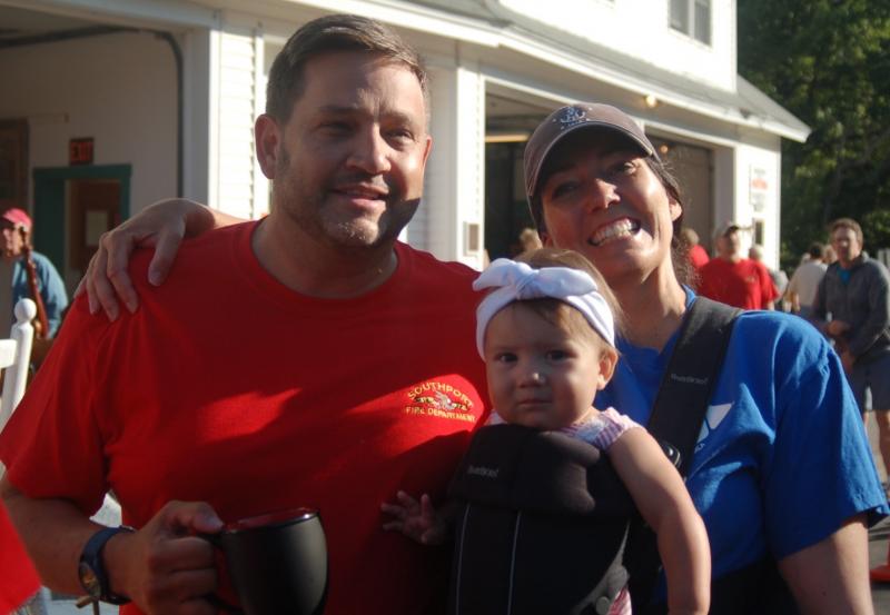 Scott Larson, Medea Harris and baby Agatha Harris search for flea market items. ART MAYERS/Boothbay Register