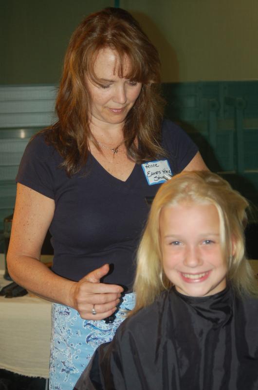Lily Nein gets a haircut from Anne Eames. ART MAYERS/Boothbay Register