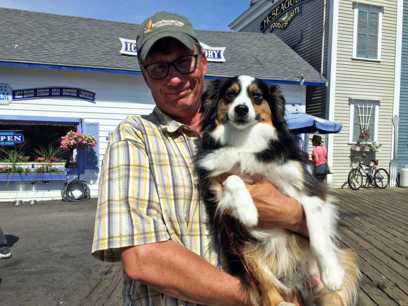Frans Jansen, from Key West, Chile and Alna, brought his dog Moose into Boothbay Harbor for a walk and shopping. SUZI THAYER/Boothbay Register