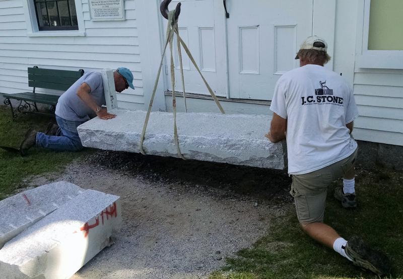 Lowering the first of the two steps into place at the 1847 Town Hall at Boothbay Railway Village Museum Aug. 25, 2016. Boothbay Railway Village Museum, Boothbay ME