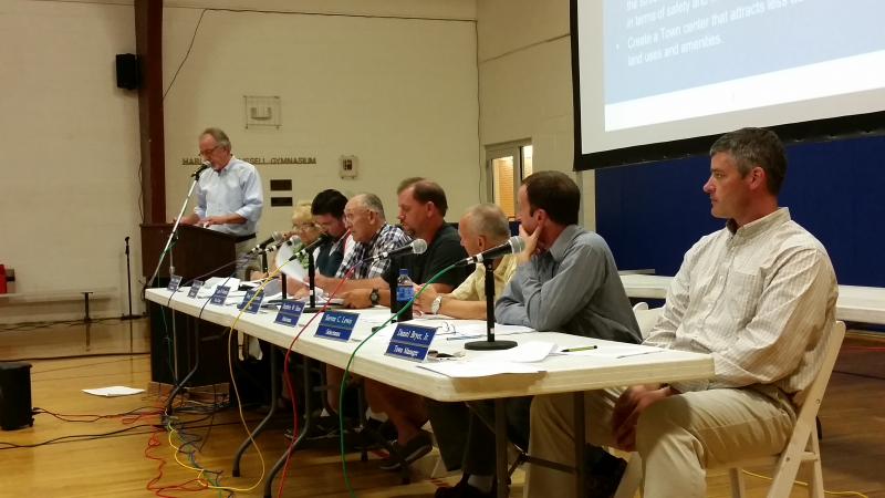 Stephen S. Sawyer Jr., left, vice president of transportation services at Sebago, addresses the crowd. Beginning second from left are secretary Sherry Tibbetts, Selectman Chuck Cunningham, Vice Chairman Douglas Burnham, Chairman Dale Harmon, Selectman Stephen Ham, Selectman Steven Lewis, and Town Manager Daniel Bryer Jr. KATRINA RICKERMANN/Boothbay Register
