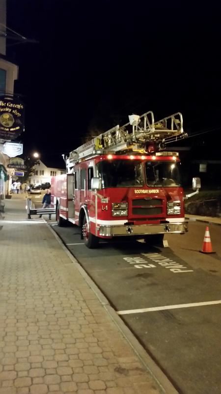 A crew of firemen and town employees were in town on Oct. 25 helping businesses get ready for the Boothbay Festival of Lights. Courtesy of Andy Bielli