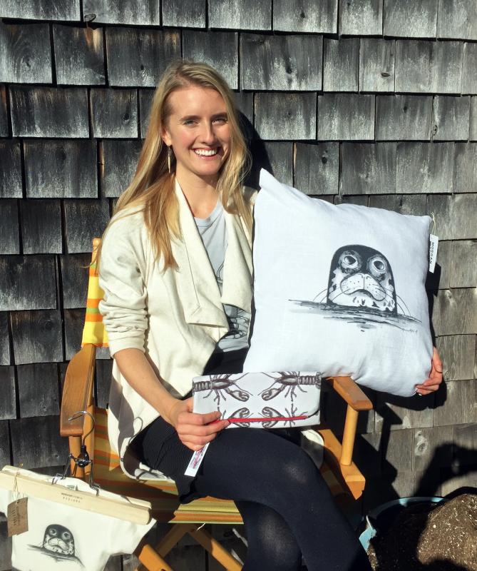 Morgan Mitchell holding one of her new homegoods designs on the deck off Calypso in Boothbay Harbor. SUZI THAYER/Boothbay Register