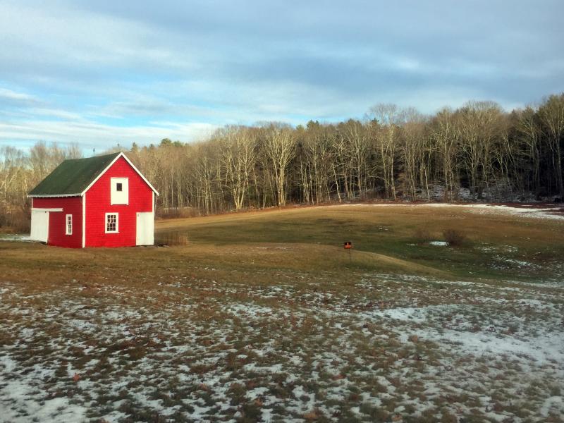 A small red barn lights up an otherwise drab landscape. SUZI THAYER/Boothbay Register