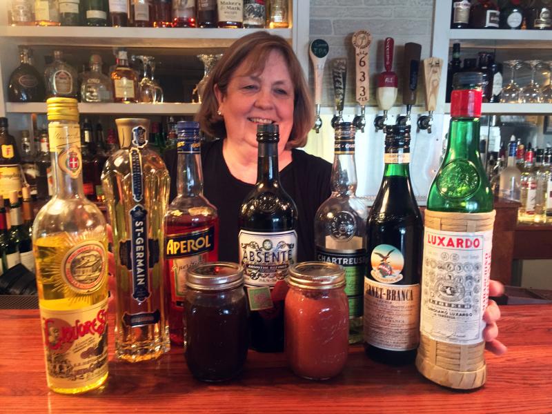 Marilyn Gorneau loves experimenting with unusual liqueurs at the Little Village Bistro bar in Wiscasset. SUZI THAYER/Boothbay Register