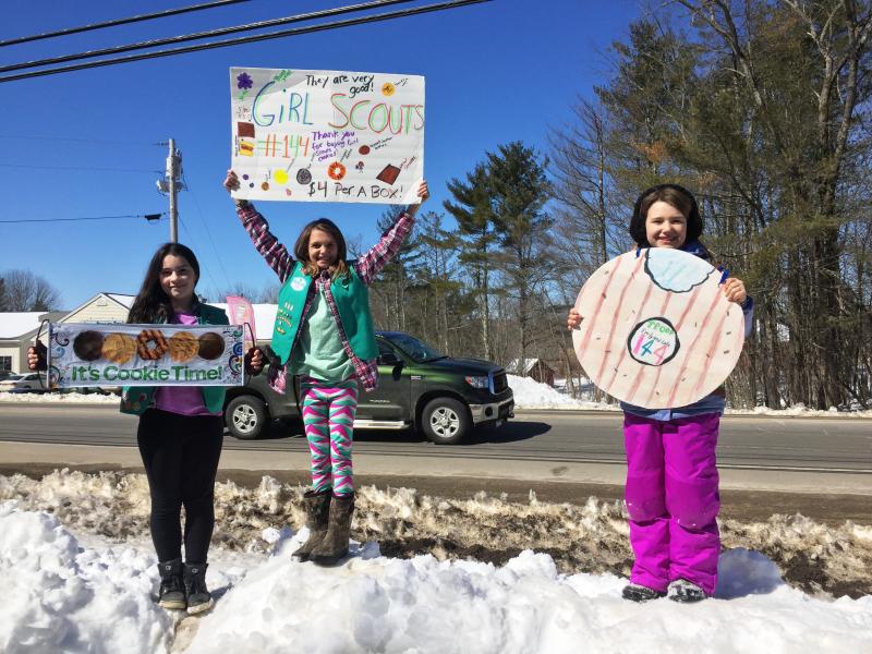 Scouts from Girl Scout Troop 144 were out in force peddling cookies while Burgers&Freys peddled its burgers in Damariscotta on March 18. SUZI THAYER/Boothbay Register