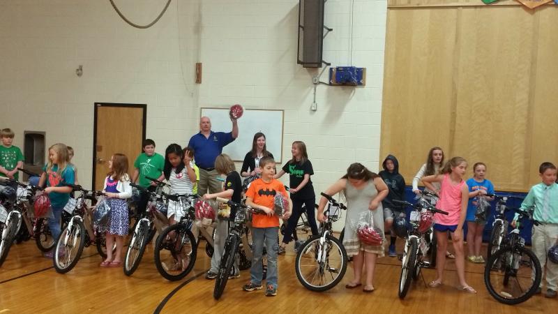 In one of his many lives, Stuart Smith works with the Bikes for Books program. Courtesy of Stuart Smith