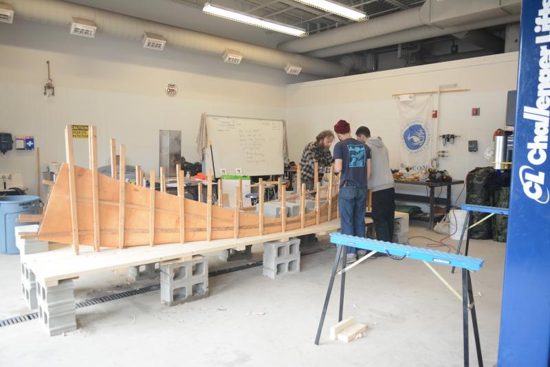 The birch bark canoe starts to take shape under the careful work of Steve Cayard and his interns, Dan Asher and Tobias Francis. Courtesy of DRA