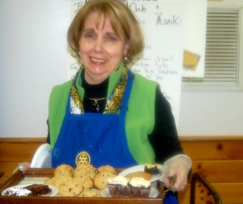 Rotary volunteer Gerry Botti serves desserts. ART MAYERS/Boothbay Register