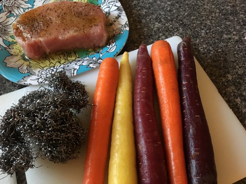 Colorful organic carrots get a scrubbing from a metal scrubber before roasting. SUZI THAYER/Boothbay Register