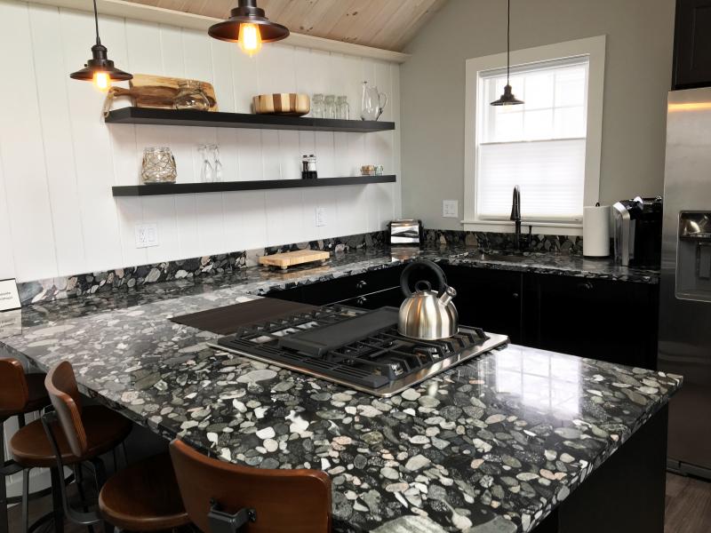The kitchen area of this newly renovated suite at Topside Inn features a real riverbed countertop. SUZI THAYER/Boothbay Register