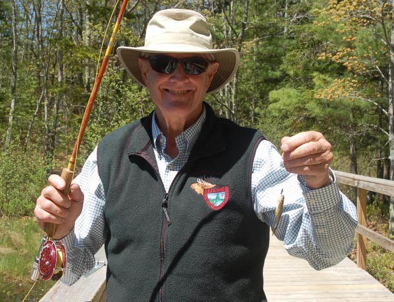 Catch of the Day. With no youth to teach, fly fisherman Steve Rubicam settles for catching minnows. ART MAYERS/Boothbay Register