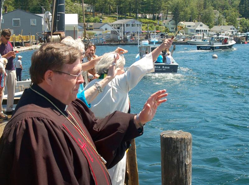 Local clergy bless the boats. ART MAYERS/Boothbay Register