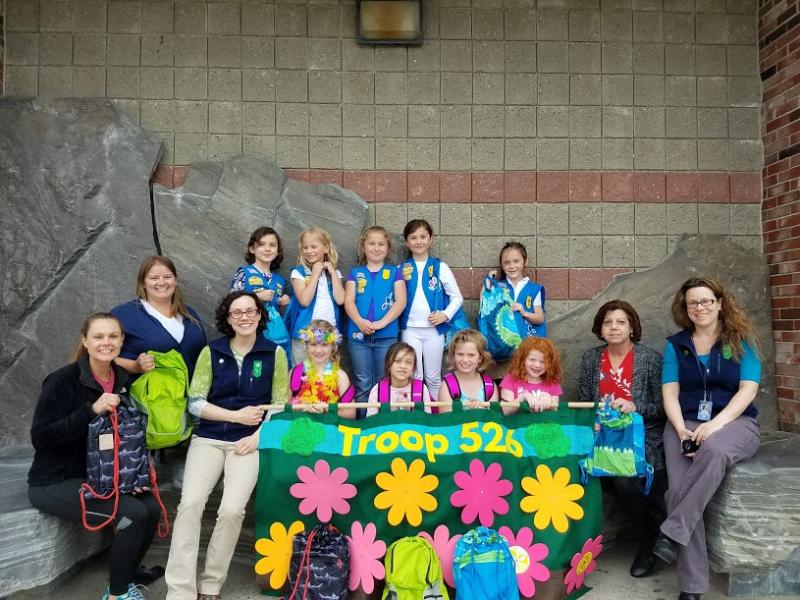 Troop 526 presents “First Night Bags”. Pictured from left are, bottom row: Loghan Walker from BRYMCA, Troop co-leaders Krystle Hodgdon and Tonia Blake, Daisies Jessica, Mahea, Adaline and Beatrice, Child Welfare Program Administrator Ilene Ford, Troop co-leader Charlinda Carlson; back row: Daisies Gigi, Arabella, Eleanor, Natalie and Olivia. Courtesy photo