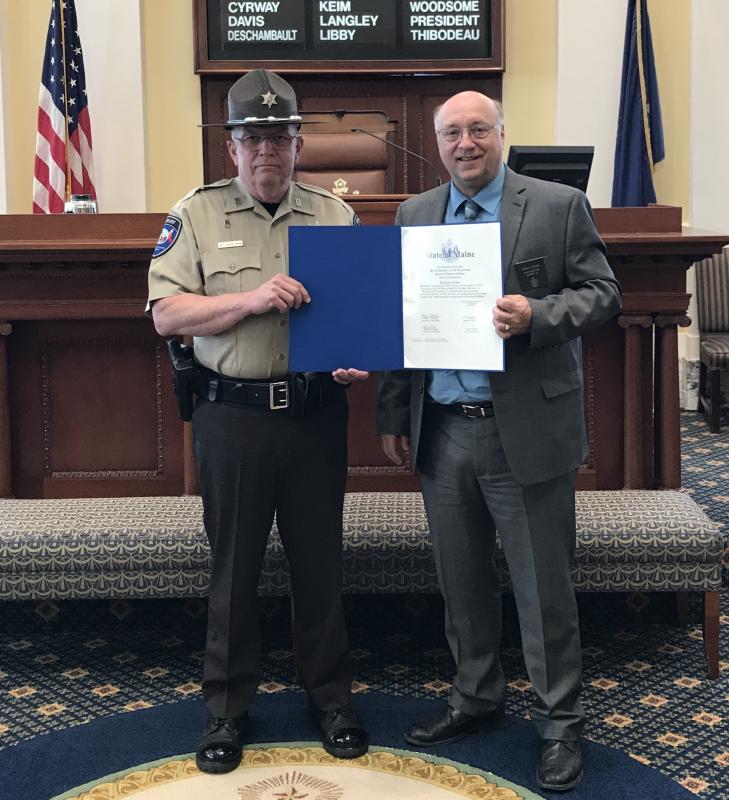 Senator Dana Dow presents Deputy Clayton Jordan with a Legislative Sentiment on May 30. Courtesy photo