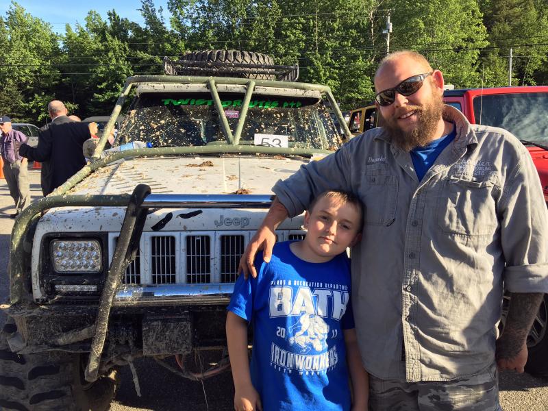 Winner of the dirtiest Jeep at the 11th annual Jeep Night at Newcastle Chrysler Dodge Jeep Ram Viper was Woolwich’s Donald Bowling, pictured here with his son, Payson. SUZI THAYER/Boothbay Register