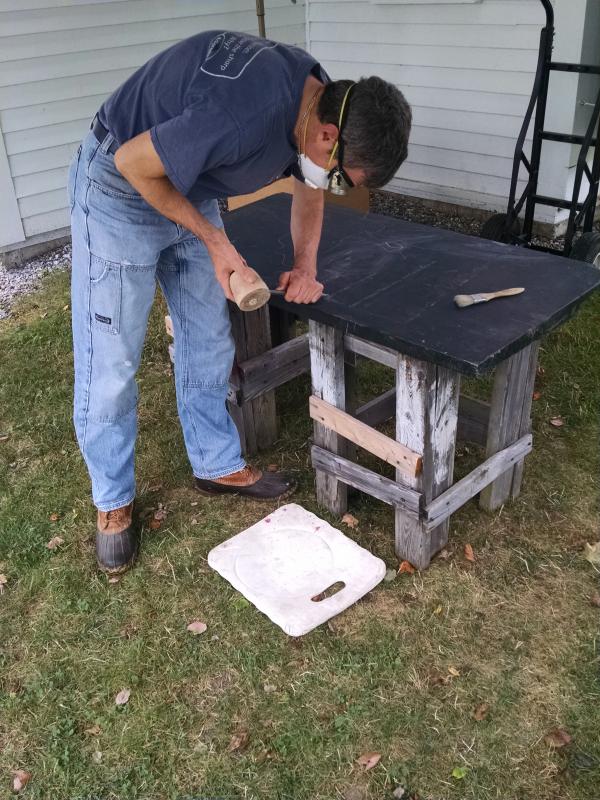 Stone artists and artisans, like stone carver Jon Doody pictured here, will be visiting the Boothbay Railway Village throughout the month of August. Courtesy of Margaret Hoffman