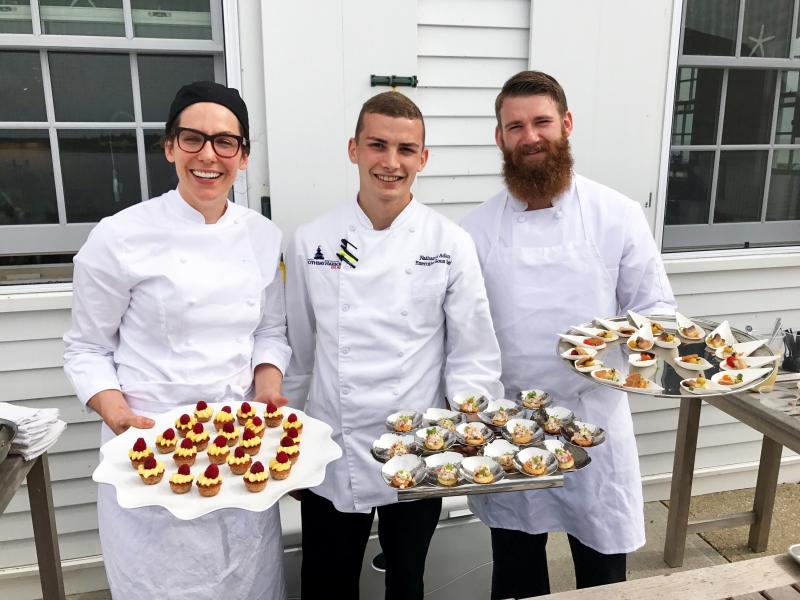 Pastry Chef Alex Tallen, left, Executive Sous Chef Nathaniel Adam, and Sous Chef Eric Jones serve hors d’oeuvres and pastries on the terrace at the inn. Courtesy of Michelle Amero