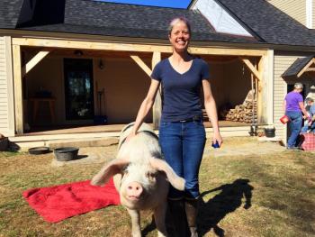Crystal Lewis and her pet pig, Rosie, at Blue Tin Farm in Edgecomb. SUZI THAYER/Boothbay Register