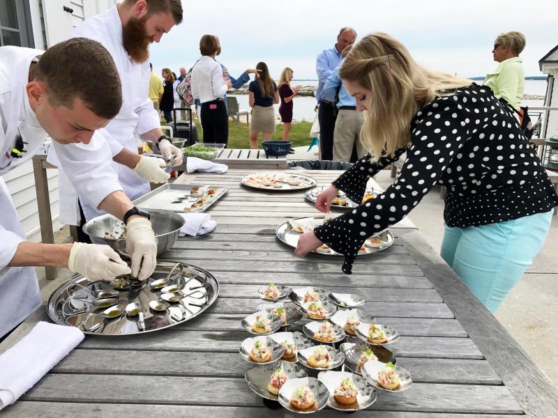 Serving hors d’oeuvres on the terrace at the Cuckolds Inn and Lighthouse. Courtesy of Michelle Amero