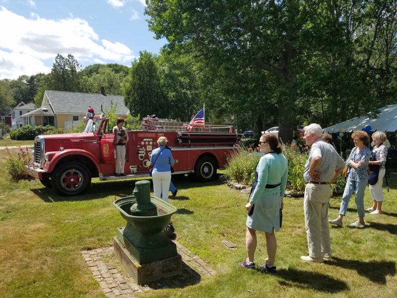 Crowds gather and take pictures around Charlie Bamberg’s vintage 1957 pumper truck. KATRINA RICKERMANN/Boothbay Register