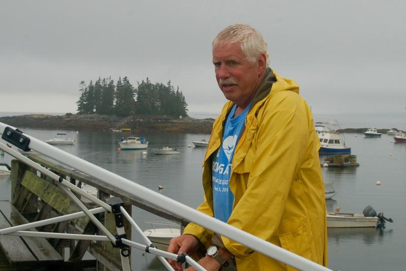 Volunteer Erik Bertelsen takes down the registration tent. ART MAYERS/Boothbay Register