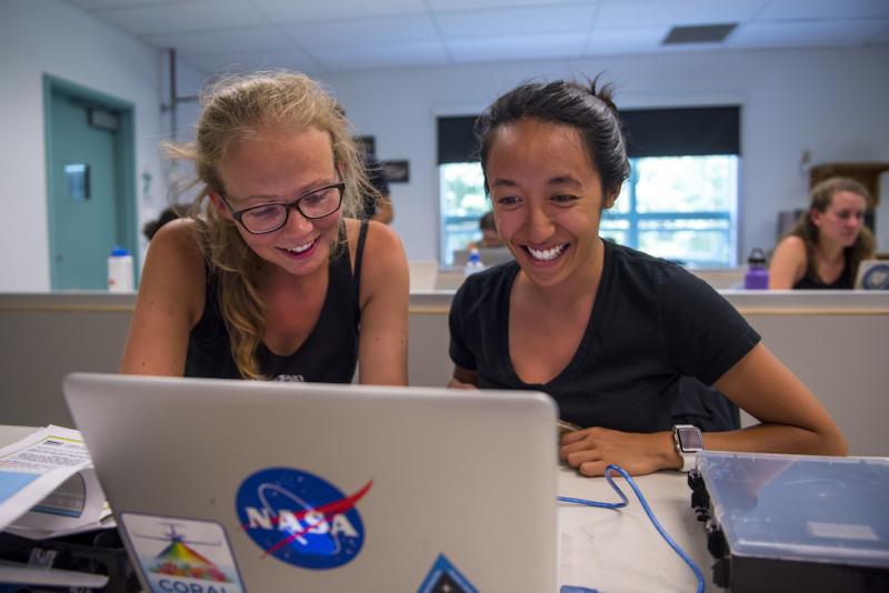 Julia Oelker, left, and Kelly Luis looking at satellite data in the ocean optics class held at the Darling Marine Center. Courtesy of Holland Haverkamp