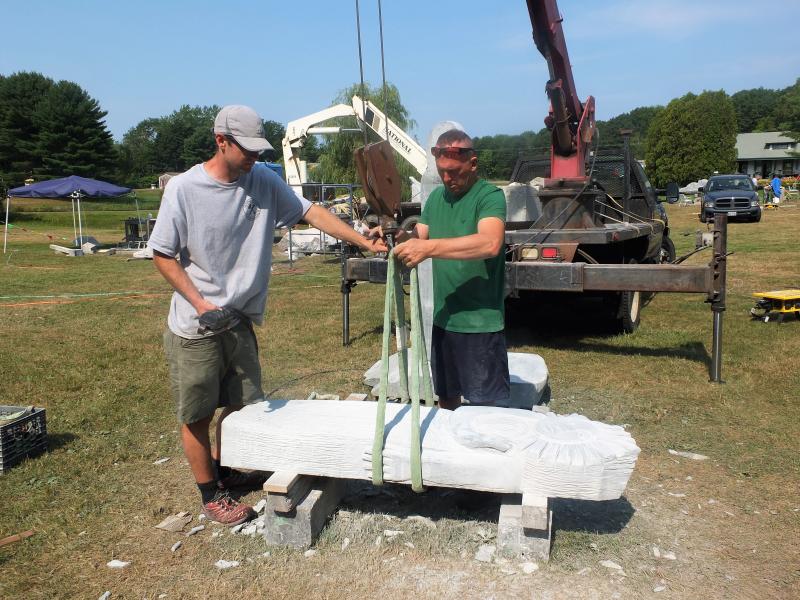The pros prepare Lise Becu’s Sun woman for installation. Becu did the work on the two-piece sculpture, the other of the moon, with the granite in the supine position above. LISA KRISTOFF/Boothbay Register
