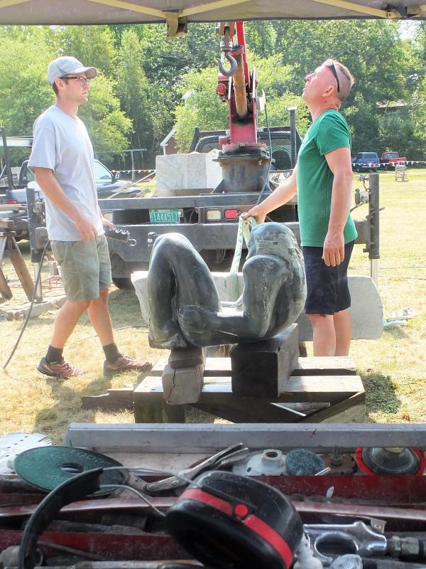 Prepping to install the nude onto its base. LISA KRISTOFF/Boothbay Register