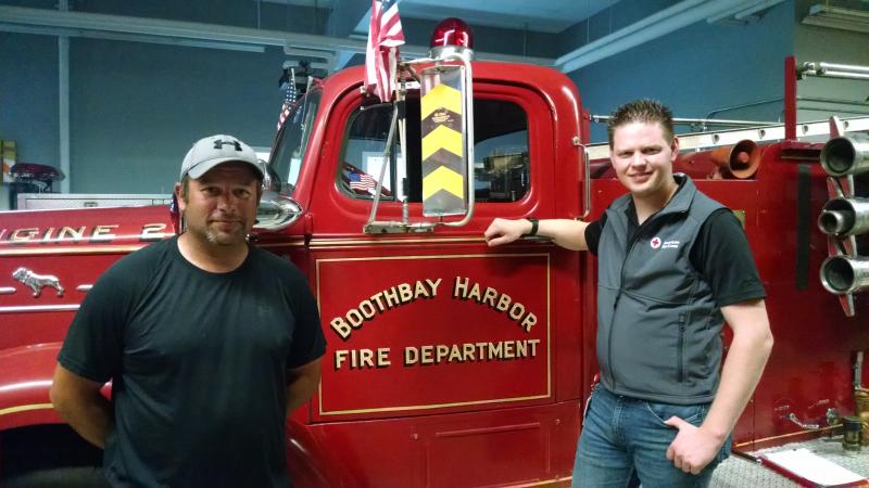 “Smoke alarms save lives. It’s that simple,” says Boothbay Harbor Fire Chief Nick Upham, left, pictured with Red Cross Disaster Program Manager Larry French. The Fire Department is among the organizations partnering with the American Red Cross of Maine to install free smoke alarms in homes on August 26.